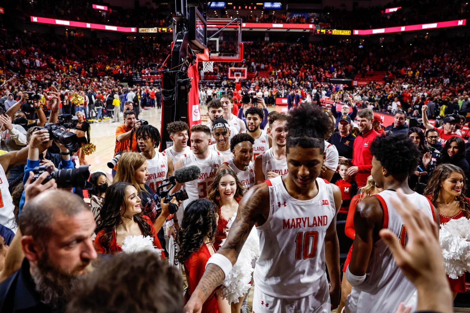 Maryland basketball players celebrate the win over No. 21 Northwestern after the game