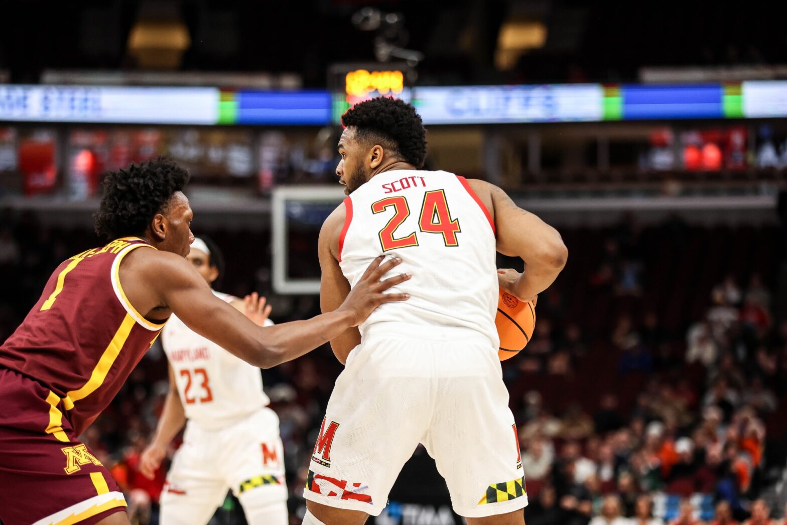 Maryland basketball forward Donta Scott backs down a Minnesota defender during the Big Ten Tournament