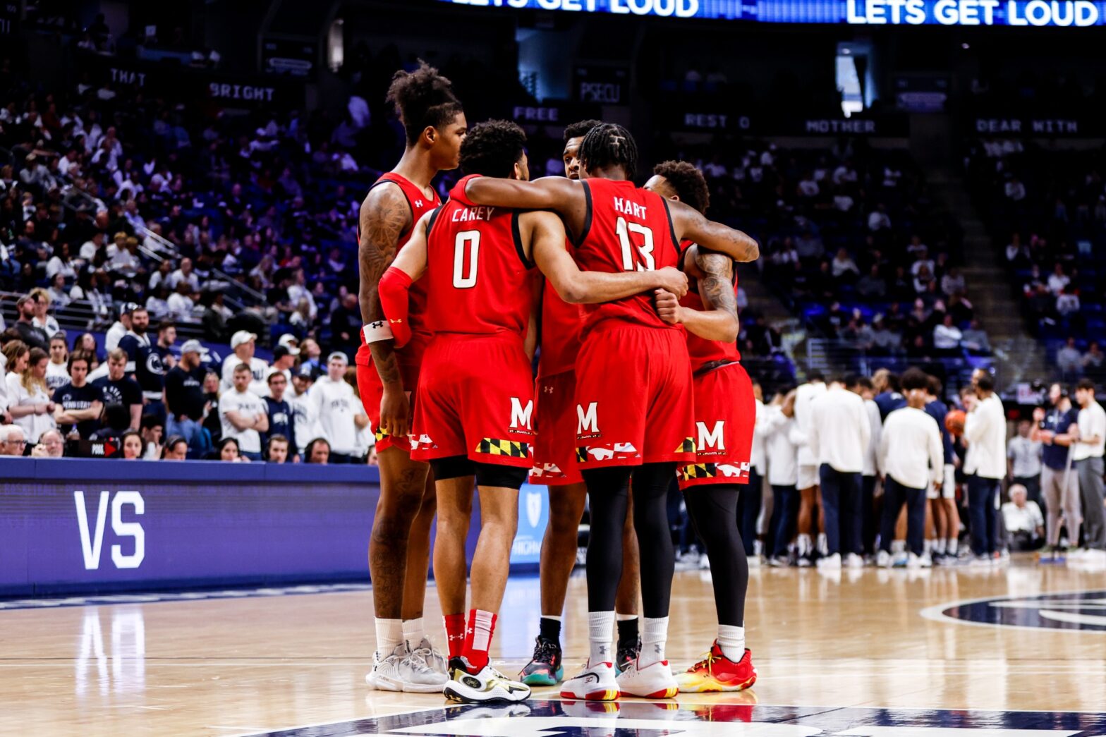 Maryland basketball players huddle on the court vs. Penn State
