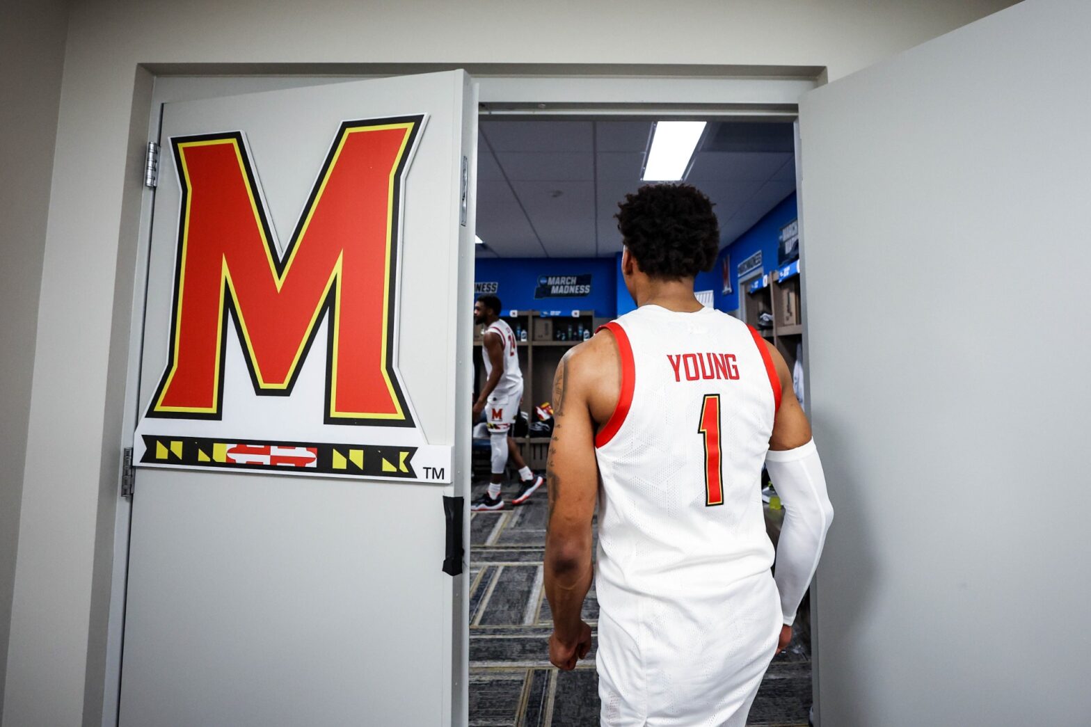 Maryland basketball guard Jahmir Young walks into the locker room after the win over West Virginia
